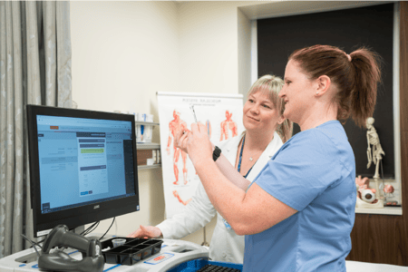 MEPN nurse and teacher in front of computer