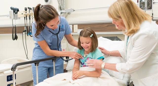 MEPN nurse assisting child